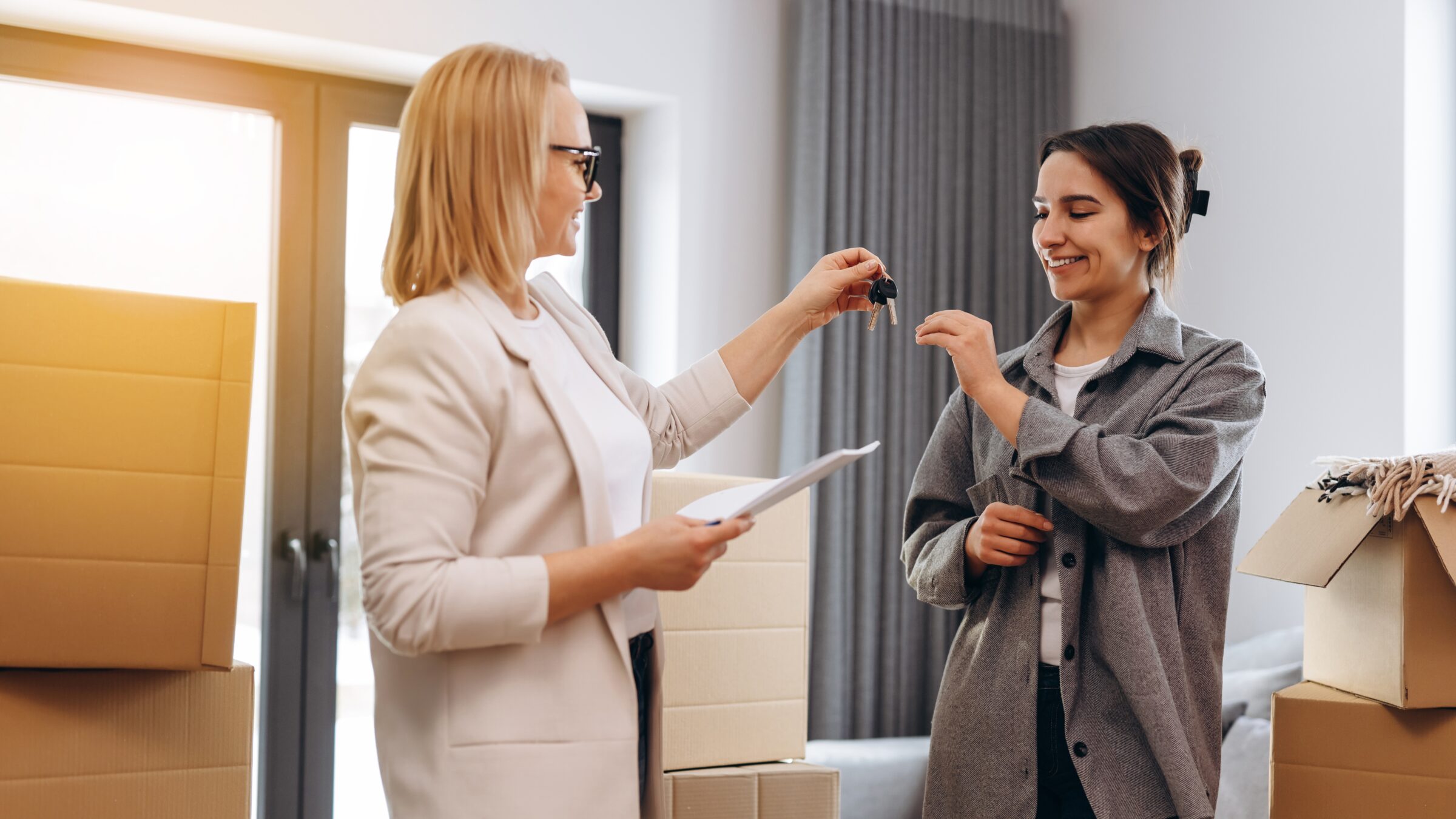 a rental business professional giving the keys to a new home renter